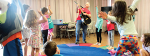 children dance to a musical performance